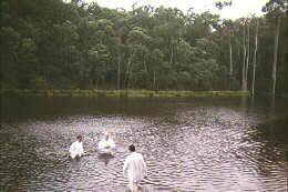 Evangelism tours in 1996, 1997 and 1998, reaching congregations across the continent in Melbourne, Dandedong, Brisbane, Perth, Sydney and Madagee. Baptizing in Lake Thompson, Australia
